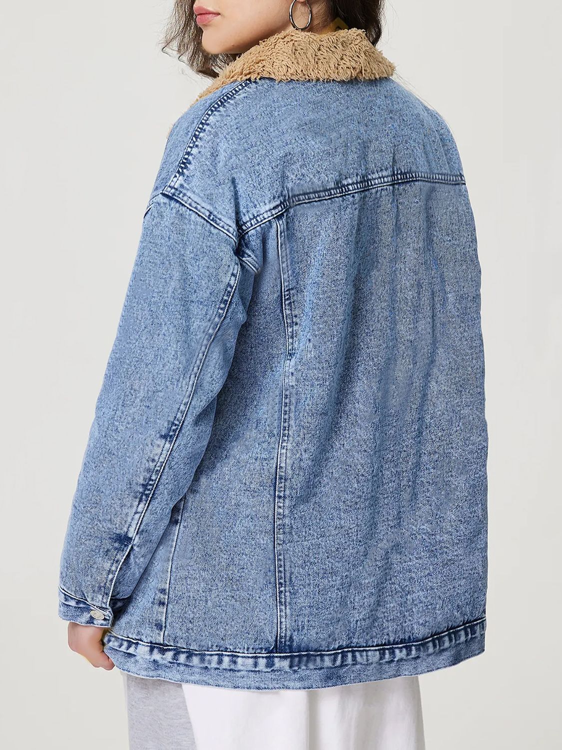 Oversized light acid wash denim trucker jacket with sherpa collar and button cuffs.