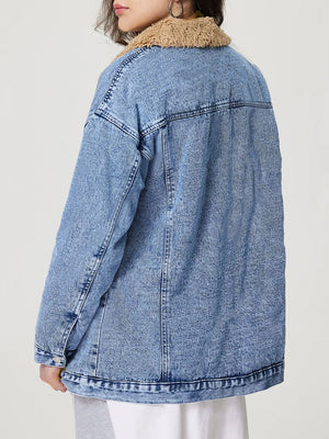 Oversized light acid wash denim trucker jacket with sherpa collar and button cuffs.