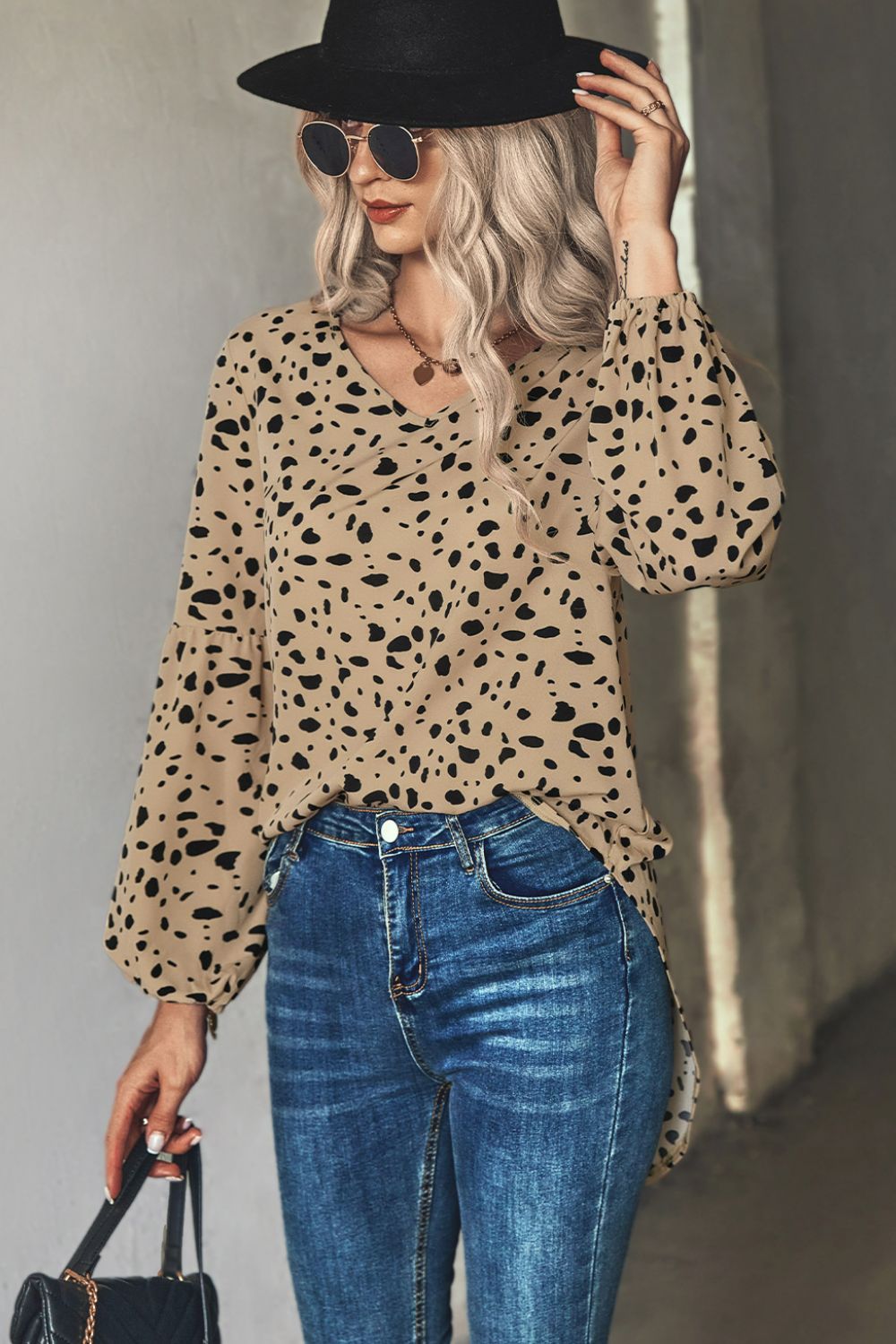 Khaki dalmatian print blouse with balloon sleeves and v-neck.