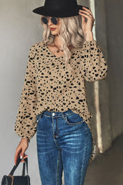 Khaki dalmatian print blouse with balloon sleeves and v-neck.