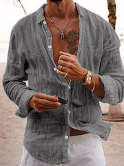 Gray relaxed fit linen button-front shirt with long sleeves and a collar.