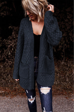 Dark gray open-knit pocket cardigan with textured pattern and long sleeves.