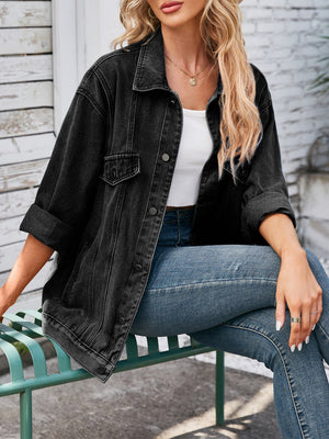 Black oversized denim trucker jacket with rolled sleeves and button front.