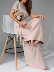 Sequin bodice and wide-leg palazzo pants ensemble in Eggshell, with a belted waist.