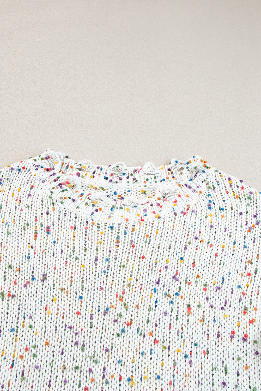 White confetti knit sweater with distressed neckline detail