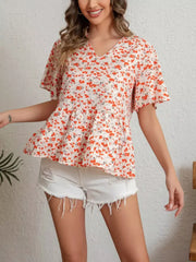 Vibrant floral peplum blouse with ruffle sleeves and v-neck.