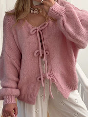 Dusty Pink knit cardigan with balloon sleeves and lace-up front detail.