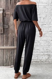 Black off-shoulder jumpsuit with drawstring waist and cuffed ankles