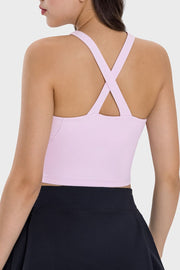 Blush pink active crop top with criss-cross back straps.