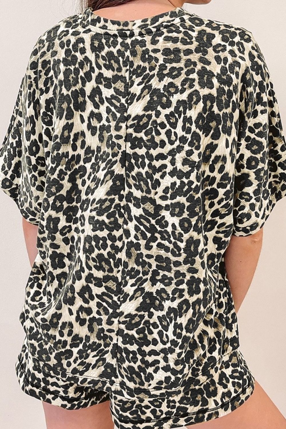 Relaxed leopard print loungewear set with short sleeves and shorts.