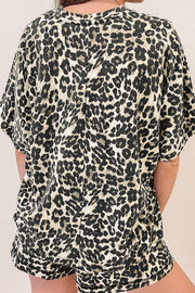 Relaxed leopard print loungewear set with short sleeves and shorts.