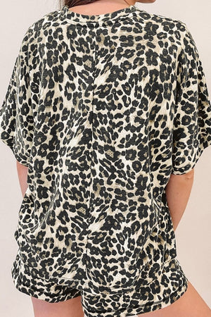 Relaxed leopard print loungewear set with short sleeves and shorts.