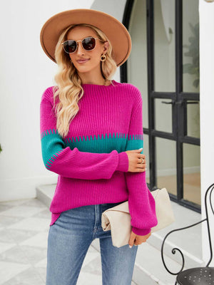 Colorblock ribbed sweater in hot pink with teal stripe detail, crew neck, and long sleeves.