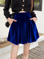 Royal blue velvet A-line skort with pockets and a pleated hem.