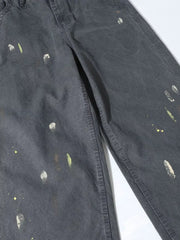 Grey sweatpants with loose fit and ink splash details