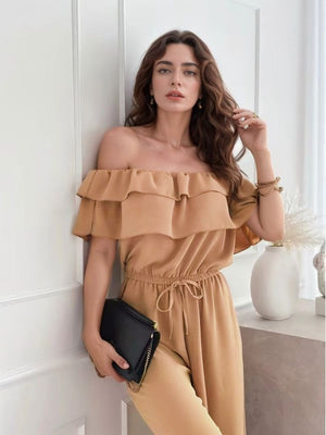 Off-the-shoulder camel jumpsuit with double ruffle detail and drawstring waist.