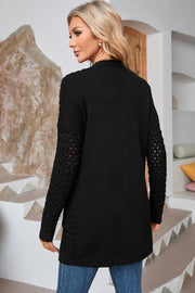 Black open-knit pocket cardigan with textured sleeves and a relaxed fit.