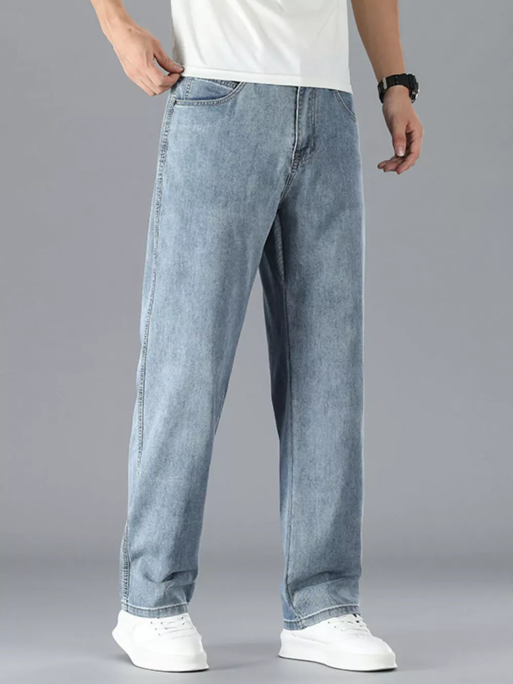 Light blue cotton straight leg jeans with a classic fit.