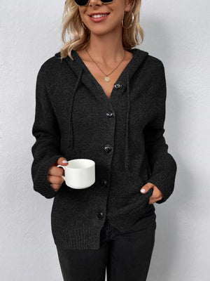 Black button-front hooded knit cardigan with drawstring detail and ribbed cuffs.
