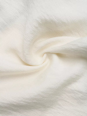 Beige tie-front two-piece ensemble fabric detail with textured weave