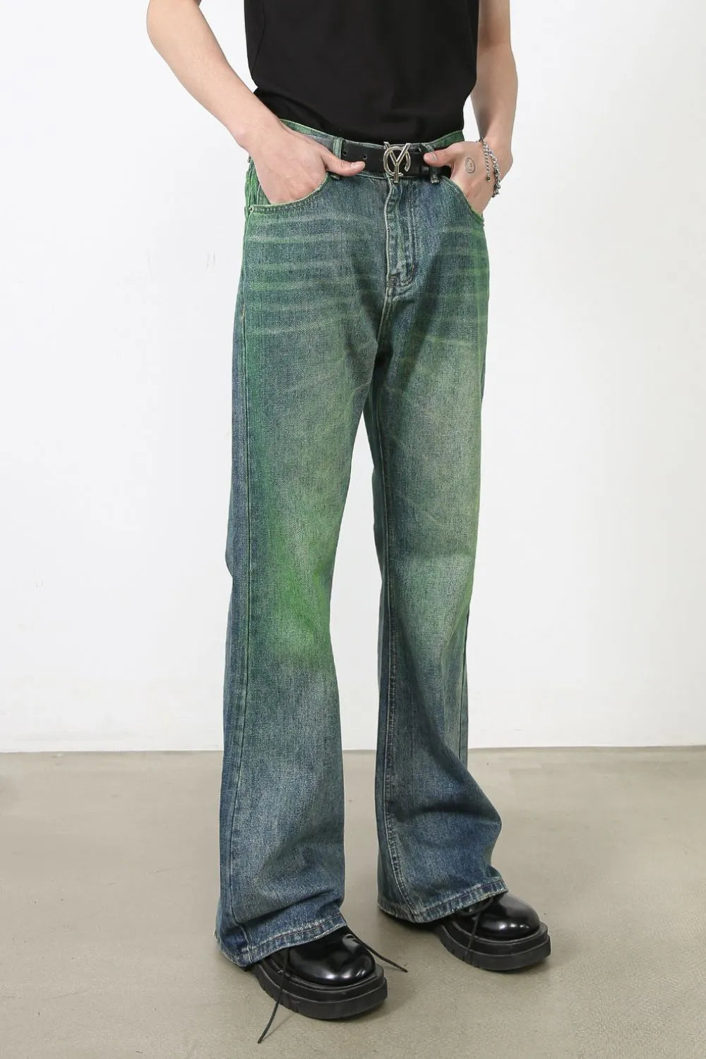 Acid wash flare denim trousers in medium with green and blue gradient.