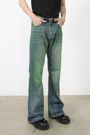 Acid wash flare denim trousers in medium with green and blue gradient.
