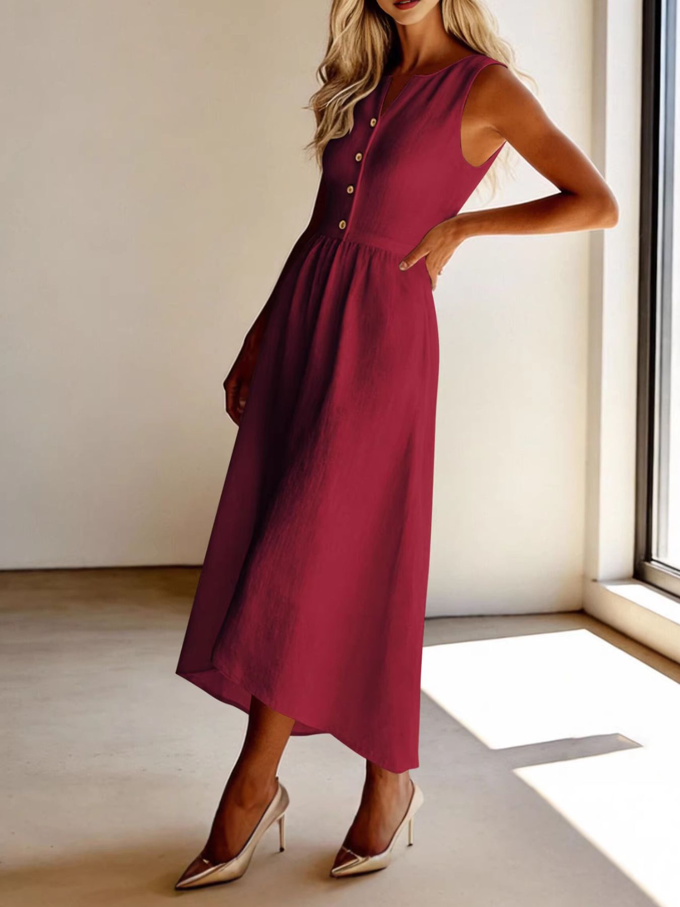 Burgundy button front flowy midi dress with a-line cut and V-neck.