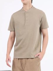 Men's desert color cotton Henley t-shirt with button placket and short sleeves.