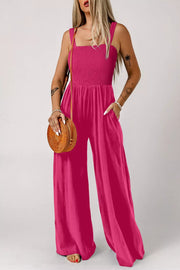 Deep rose smocked bodice wide leg romper with square neckline and pockets.