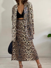 Sequin leopard longline tailored jacket with notched collar and button front.
