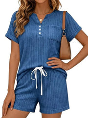 Blue ribbed knit loungewear set with henley neckline, pocket, and drawstring shorts.