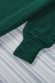 Textured green acrylic cardigan with puff sleeves and ribbed cuffs.