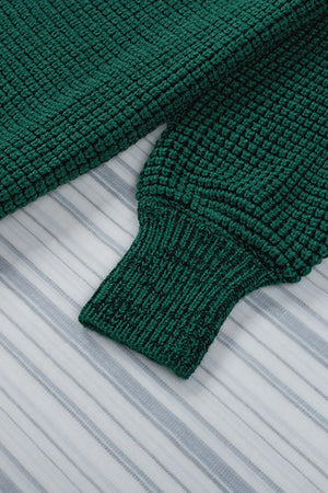 Textured green acrylic cardigan with puff sleeves and ribbed cuffs.