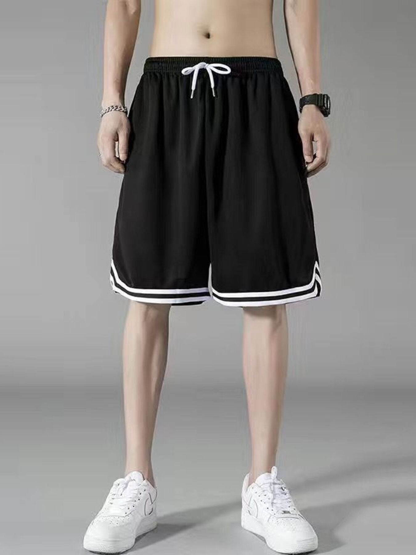 Men's black athletic shorts with white trim and drawstring waist.