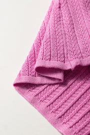 Red-violet knit blouse with square neckline and flutter sleeves, 100% viscose.