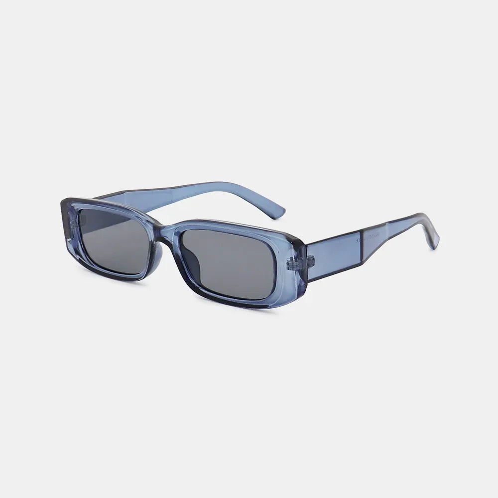 Chunky rectangular sunglasses in dusty blue with dark lenses and thick frames.