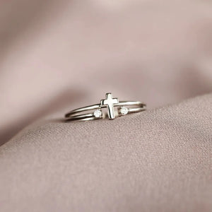 Silver double band ring with a cross and two crystals.