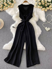 Black V-neck wide leg jumpsuit with tie belt and button details