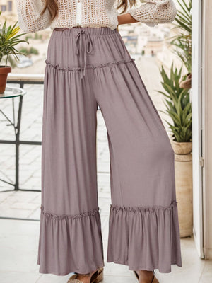 Mauve wide-leg pants with ruffle trim and drawstring waist