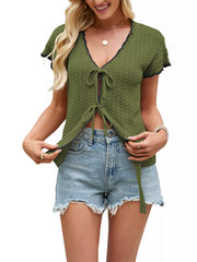 Green knit tie-front cardigan with short sleeves and a V-neckline.
