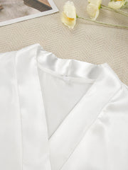 White satin robe with lace trim detail and V-neckline