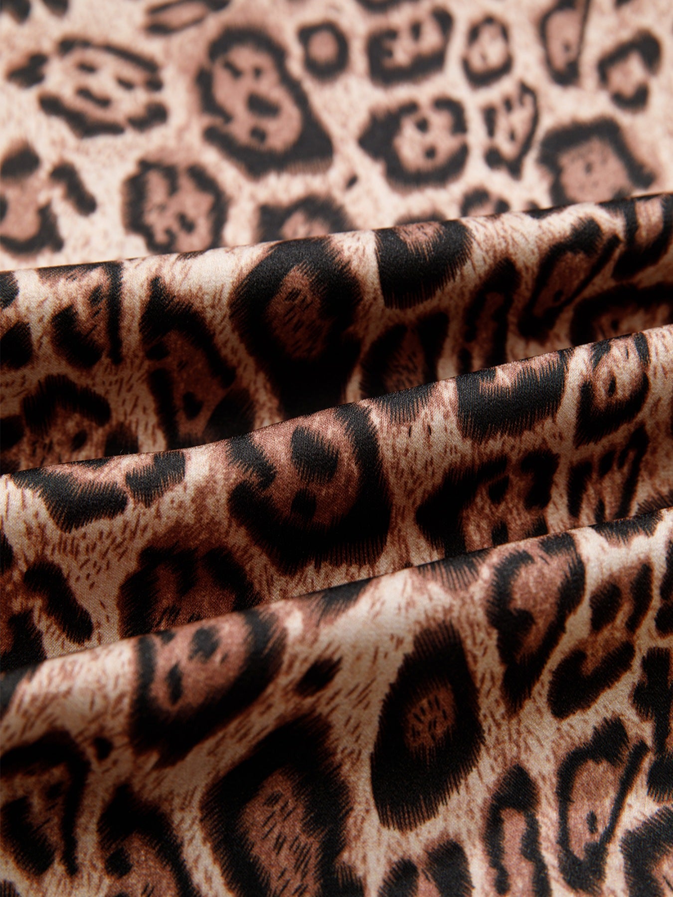 Leopard print blouse with puff sleeves and bow tie detail