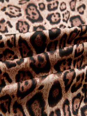 Leopard print blouse with puff sleeves and bow tie detail