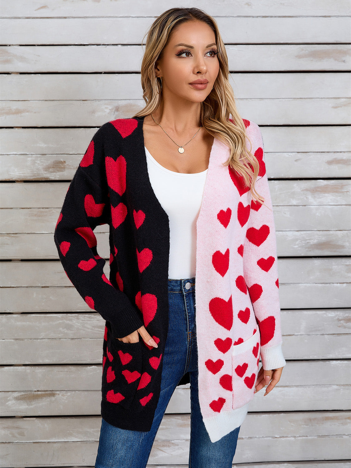 Heartbeat split-panel open cardigan in black and pink with red heart pattern, acrylic blend.
