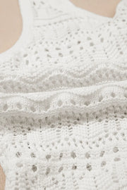 White crochet tank top with ruched front detail and open knit pattern.
