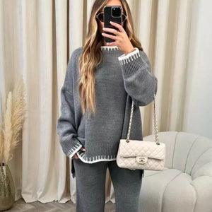Gray relaxed sweater set with white contrast trim on neckline and cuffs.