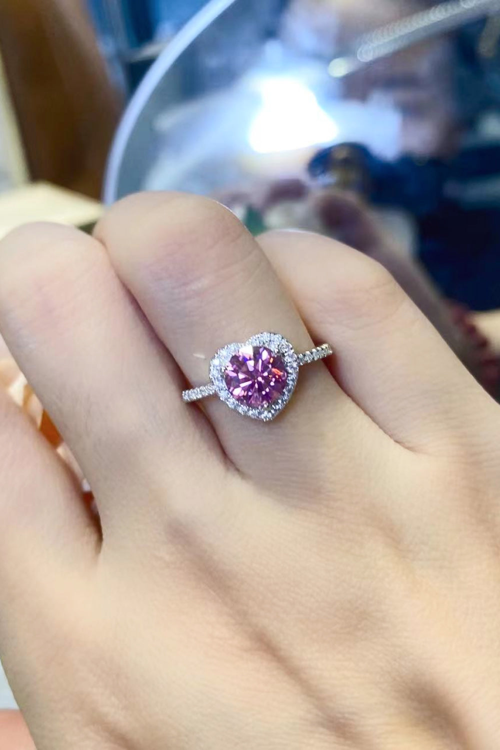 Pink moissanite heart halo ring with diamond band