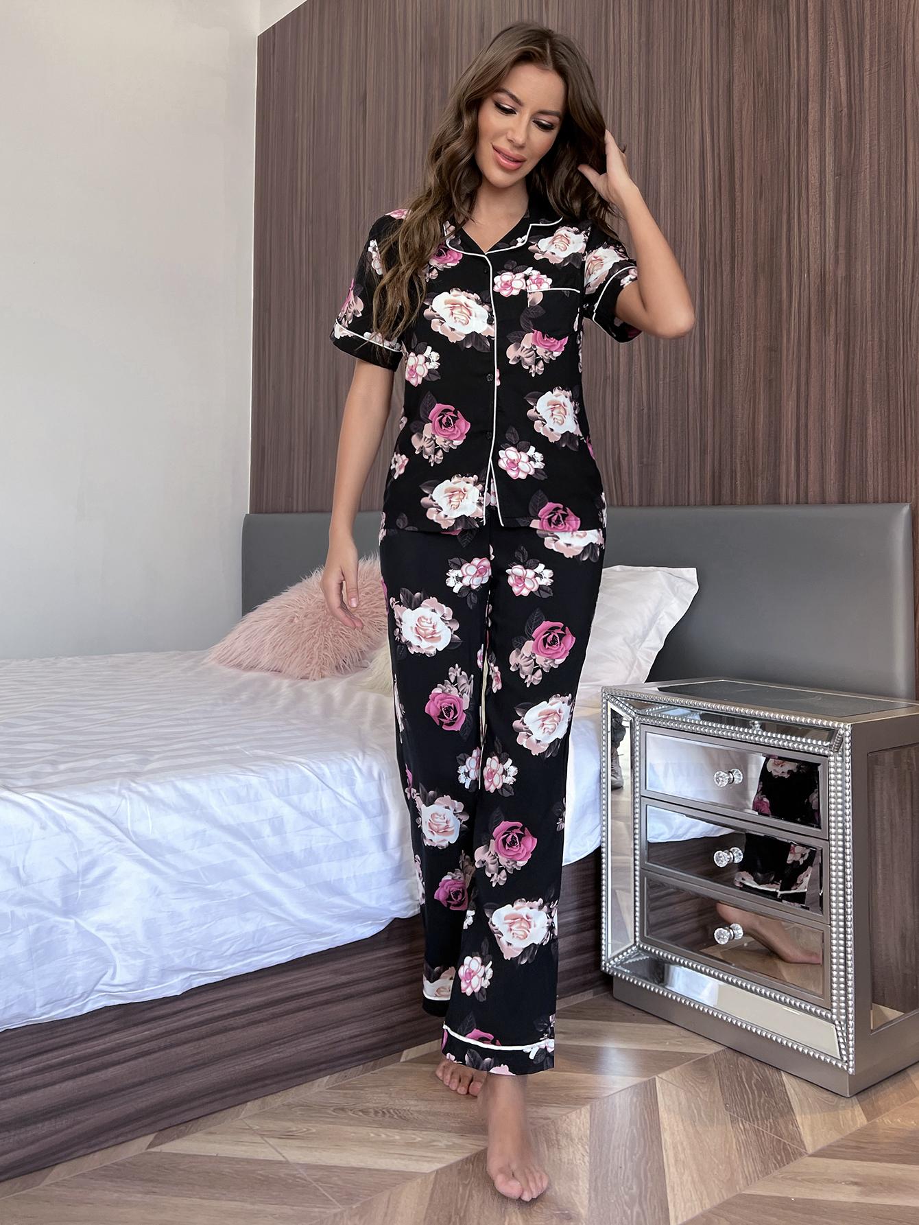Floral print pajama set with contrast trim, featuring short sleeves and buttoned top.