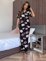 Floral print pajama set with contrast trim, featuring short sleeves and buttoned top.