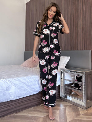 Floral print pajama set with contrast trim, featuring short sleeves and buttoned top.
